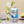 Load image into Gallery viewer, Image of a 330ml Soda Water can open in from of a glass of soda water with lots of ice and a lime and mint garnish. Behind the can and glass are natural rocks with lime quarters and mint. 

