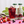 Load image into Gallery viewer, Lifestyle shot of a glass of summer berries with ice, and 2 bottles of summer berries in the background
